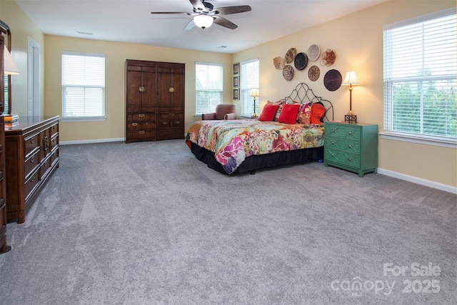 7397 Mill Ruins Ave SW, Concord, NC 28025 - carpeted bedroom with multiple windows and a ceiling fan