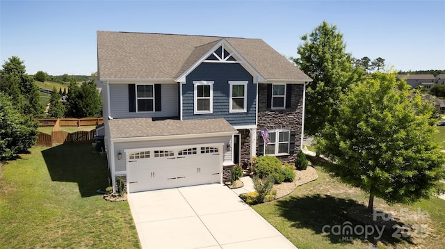 7397 Mill Ruins Ave SW, Concord, NC 28025 - view of front facade featuring stone siding, concrete driveway, an attached garage, and a shingled roof
