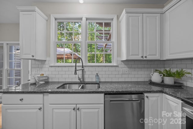 263 Fernbrook Dr, Mooresville, NC 28117 - kitchen with appliances with stainless steel finishes, a sink, white cabinets, and tasteful backsplash