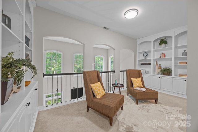 263 Fernbrook Dr, Mooresville, NC 28117 - living area featuring light colored carpet and built in features