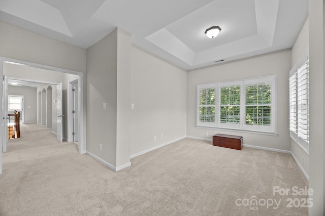 263 Fernbrook Dr, Mooresville, NC 28117 - carpeted empty room with baseboards and a tray ceiling