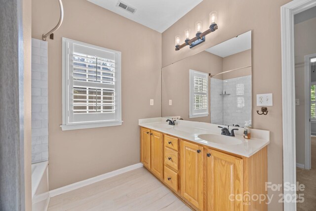 263 Fernbrook Dr, Mooresville, NC 28117 - full bathroom featuring plenty of natural light, wood finished floors, double vanity, and baseboards