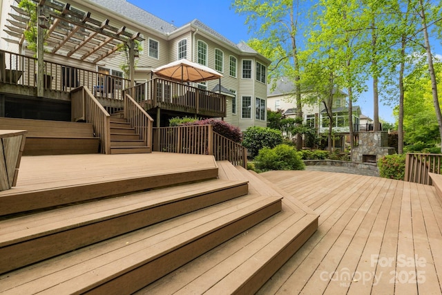 263 Fernbrook Dr, Mooresville, NC 28117 - deck with a pergola, stairway, and a fireplace