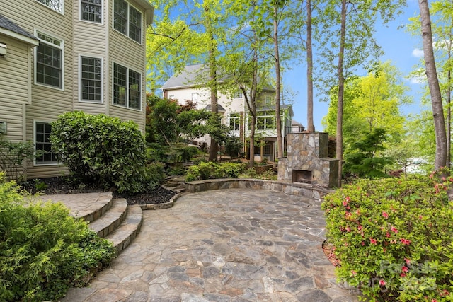 263 Fernbrook Dr, Mooresville, NC 28117 - view of patio / terrace with an outdoor stone fireplace
