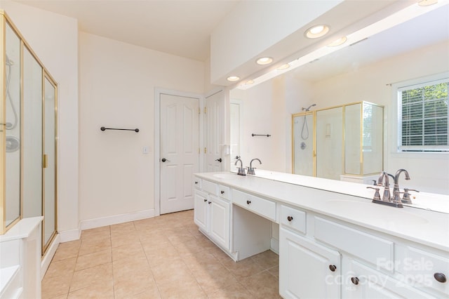 full bath featuring a stall shower, tile patterned flooring, double vanity, and recessed lighting