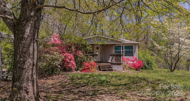 19 Blackberry Ln Unit 42, Candler, NC 28715 - view of front of house with a forest view and a porch