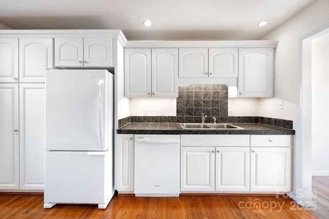 501 Crowfields Ln, Asheville, NC 28803 - kitchen with a sink, white appliances, light wood-style floors, recessed lighting, and white cabinetry