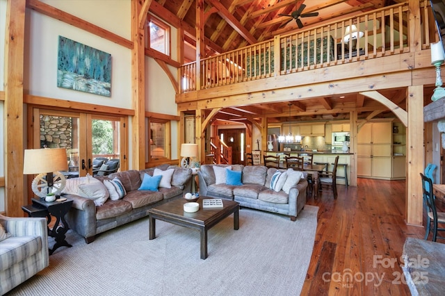 54 Cottage Grove Dr, Nebo, NC 28761 - living area featuring ceiling fan, beam ceiling, wood-type flooring, high vaulted ceiling, and french doors