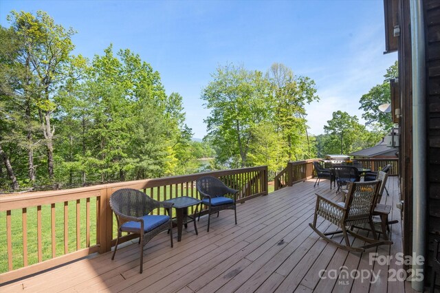 54 Cottage Grove Dr, Nebo, NC 28761 - wooden terrace with outdoor dining area