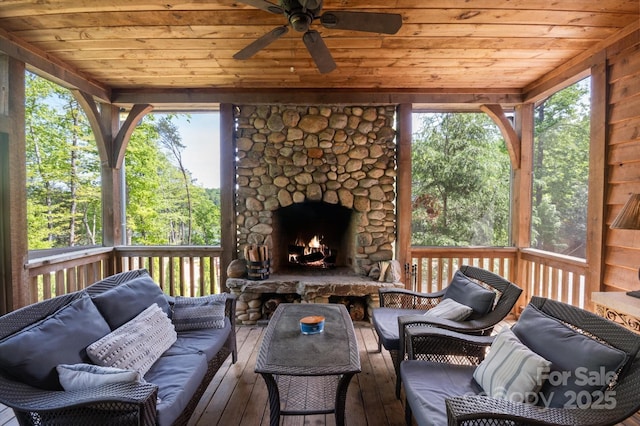 54 Cottage Grove Dr, Nebo, NC 28761 - sunroom / solarium with ceiling fan, an outdoor living space with a fireplace, and plenty of natural light