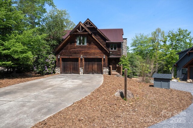 54 Cottage Grove Dr, Nebo, NC 28761 - view of front of house with a garage, log exterior, concrete driveway, and stone siding