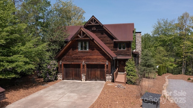 54 Cottage Grove Dr, Nebo, NC 28761 - log home featuring a chimney, metal roof, a garage, concrete driveway, and stone siding