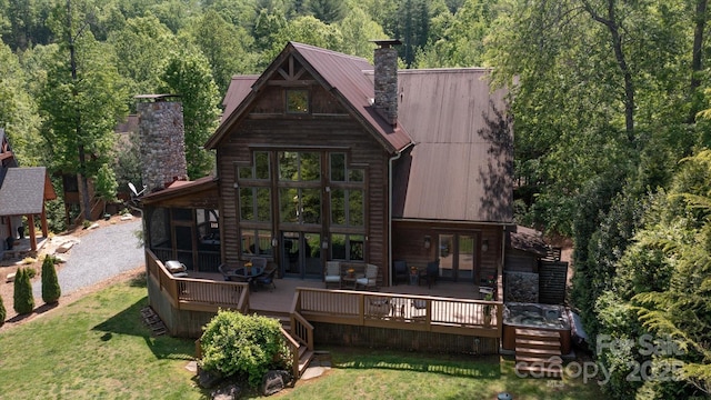 54 Cottage Grove Dr, Nebo, NC 28761 - rear view of property featuring a view of trees, a chimney, metal roof, and a wooden deck