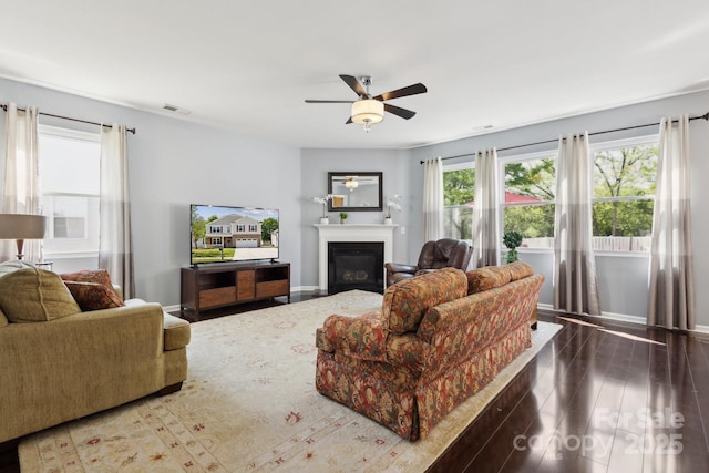 221 Sycamore Creek Rd, Fort Mill, SC 29708 - living room with a glass covered fireplace, baseboards, a ceiling fan, visible vents, and wood finished floors