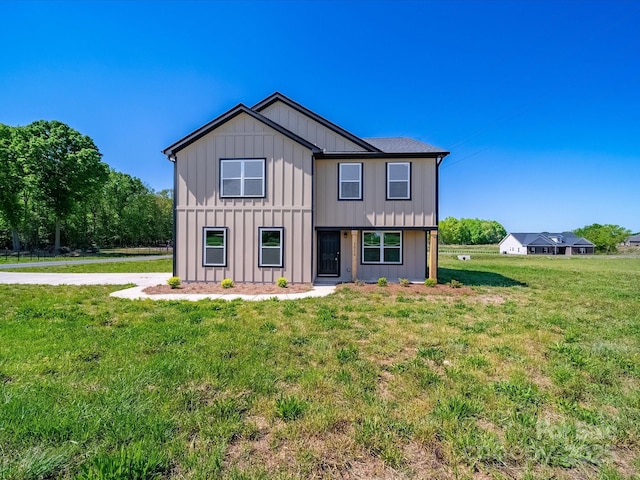 3012 Isle Ln, Monroe, NC 28110 - back of property with board and batten siding and a lawn