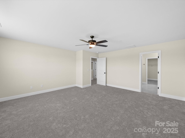 3012 Isle Ln, Monroe, NC 28110 - unfurnished bedroom featuring carpet floors, a spacious closet, baseboards, and ceiling fan