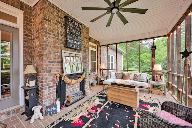 sunroom / solarium with an outdoor hangout area, a healthy amount of sunlight, and a ceiling fan