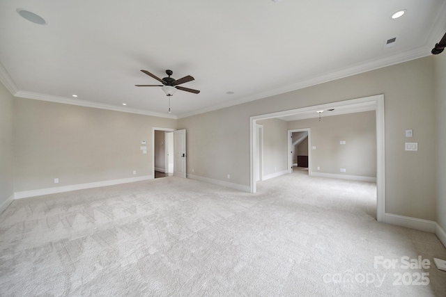 spare room with light carpet, ornamental molding, and ceiling fan