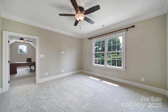 empty room with visible vents, baseboards, ceiling fan, crown molding, and carpet floors