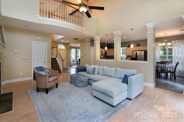 3404 Pasture View Ct, Charlotte, NC 28269 - living room featuring ornate columns, ceiling fan, baseboards, a towering ceiling, and recessed lighting