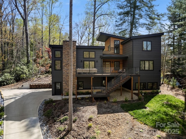 146 Timber Creek Rd, Hendersonville, NC 28739 - rear view of property with stairs and a chimney