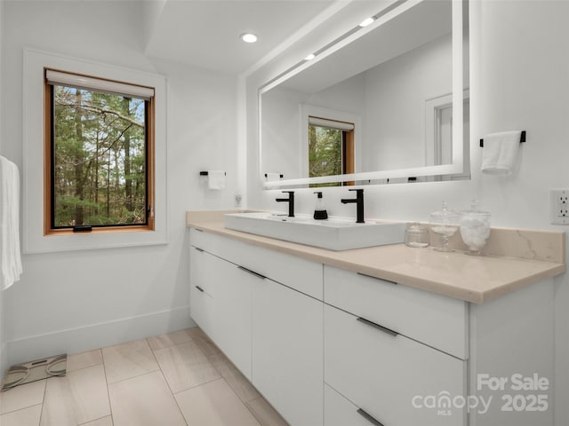 146 Timber Creek Rd, Hendersonville, NC 28739 - bathroom featuring a sink, baseboards, double vanity, and recessed lighting