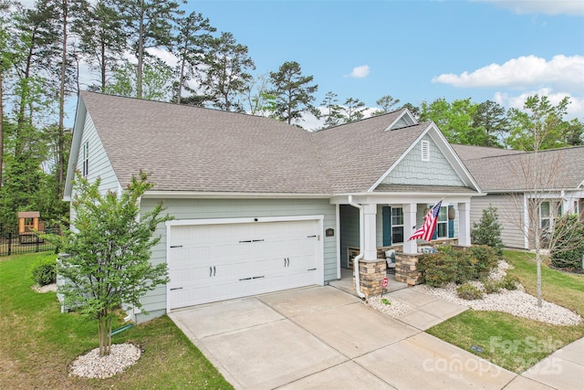 view of front of home featuring a front lawn, driveway, a porch, a garage, and roof with shingles