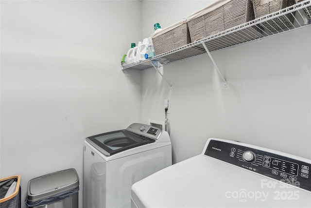 washroom featuring washer and dryer and laundry area