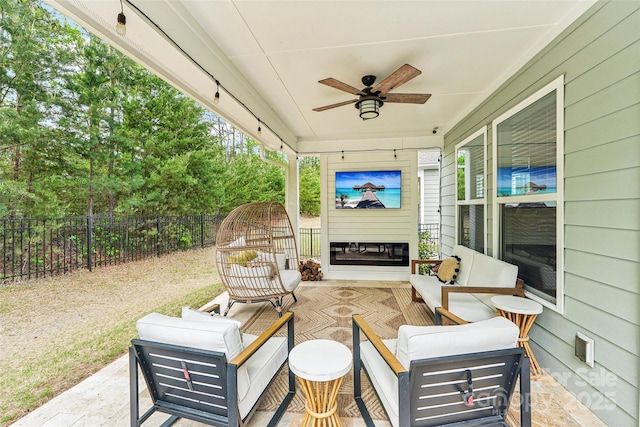 view of patio with ceiling fan, a fenced backyard, outdoor lounge area, and visible vents