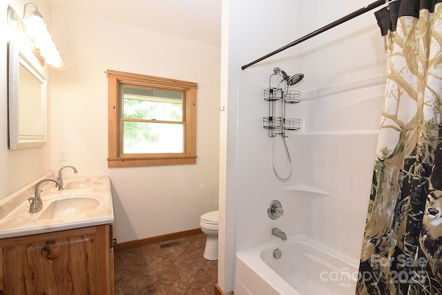 bathroom featuring baseboards, visible vents, a sink, and toilet