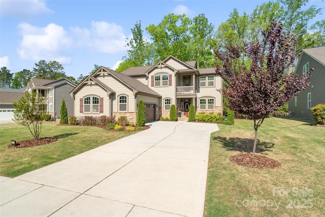 513 Sandbar Pt, Lake Wylie, SC 29710 - view of front of home with a balcony, driveway, stone siding, a front lawn, and a garage