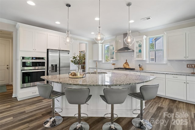 513 Sandbar Pt, Lake Wylie, SC 29710 - kitchen with wall chimney range hood, plenty of natural light, visible vents, appliances with stainless steel finishes, and a sink