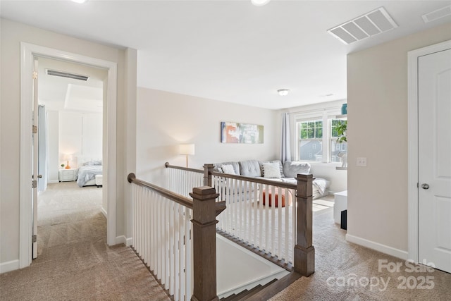 513 Sandbar Pt, Lake Wylie, SC 29710 - hallway featuring an upstairs landing, baseboards, carpet, and visible vents