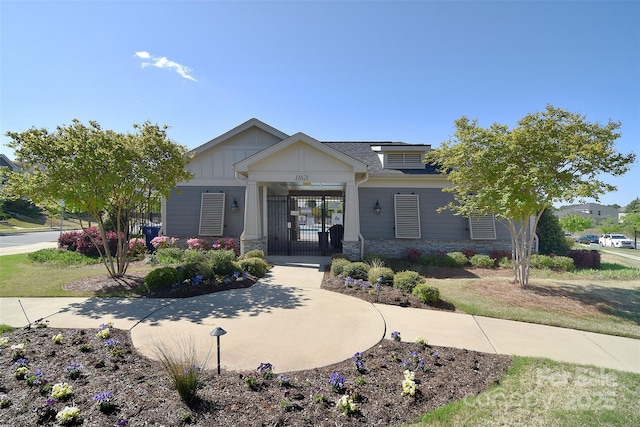 11616 Solstice Way, Huntersville, NC 28078 - view of front facade featuring stone siding and a gate