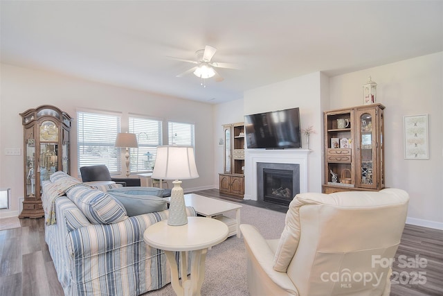 11616 Solstice Way, Huntersville, NC 28078 - living room featuring baseboards, wood finished floors, a ceiling fan, and a fireplace with flush hearth