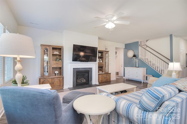 11616 Solstice Way, Huntersville, NC 28078 - living area with wood finished floors, stairs, visible vents, a ceiling fan, and a fireplace with flush hearth