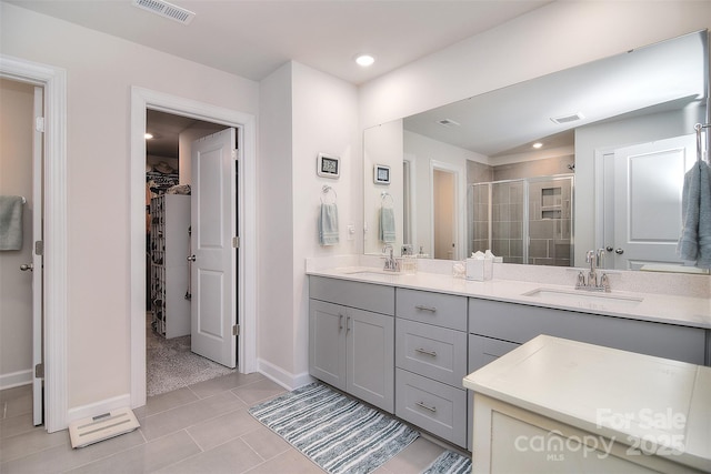 11616 Solstice Way, Huntersville, NC 28078 - full bath featuring a stall shower, double vanity, a sink, and visible vents