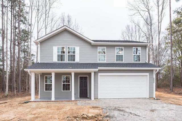 4149 River Run Cir, Hickory, NC 28602 - traditional home with an attached garage, a porch, a shingled roof, and dirt driveway