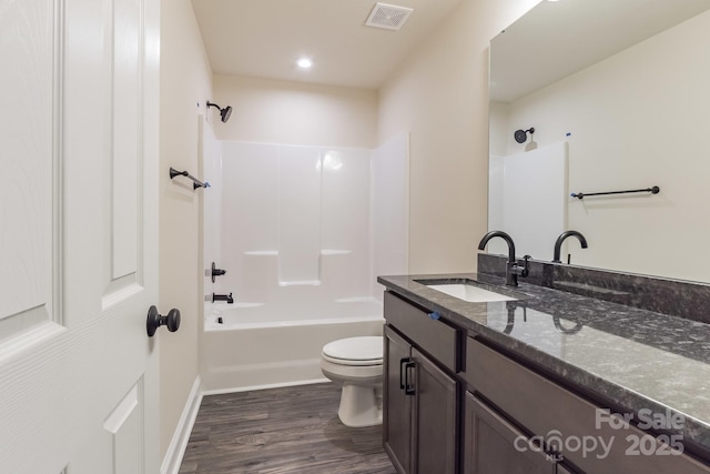 4149 River Run Cir, Hickory, NC 28602 - bathroom featuring washtub / shower combination, vanity, toilet, visible vents, and wood finished floors