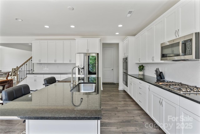 184 Tetcott St, Mooresville, NC 28115 - kitchen with recessed lighting, a sink, tasteful backsplash, appliances with stainless steel finishes, and white cabinetry