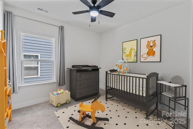 184 Tetcott St, Mooresville, NC 28115 - bedroom with a crib, baseboards, visible vents, and a ceiling fan