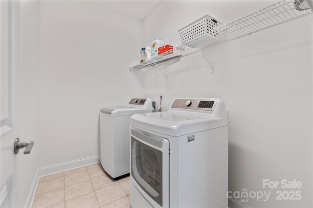 184 Tetcott St, Mooresville, NC 28115 - clothes washing area with separate washer and dryer, baseboards, laundry area, and light tile patterned flooring