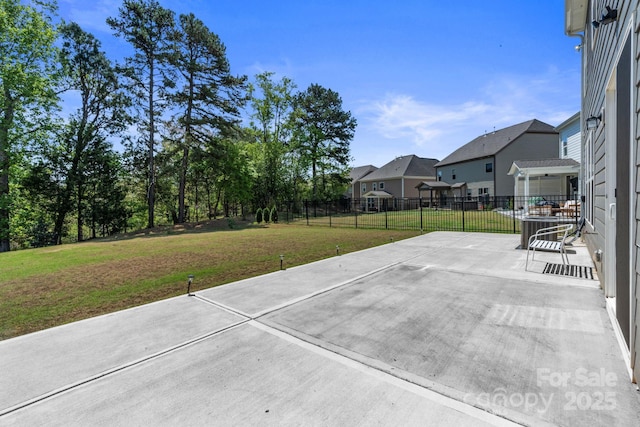 184 Tetcott St, Mooresville, NC 28115 - view of patio featuring a residential view, central AC, and fence