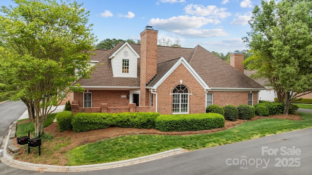 7502 Hurstbourne Green Dr, Charlotte, NC 28277 - cape cod house featuring roof with shingles, brick siding, and a chimney