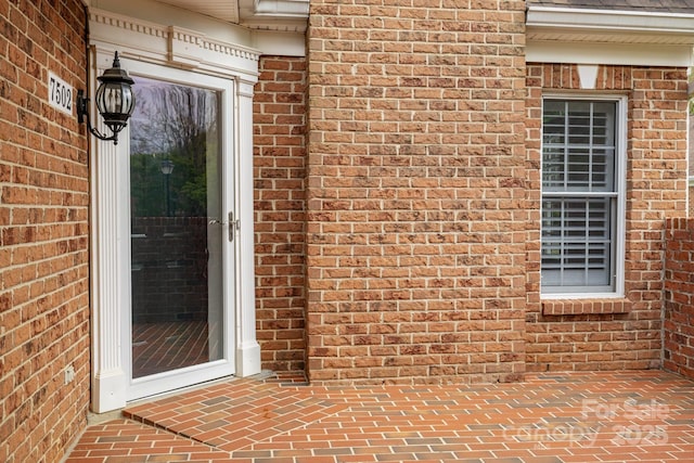 7502 Hurstbourne Green Dr, Charlotte, NC 28277 - doorway to property with brick siding