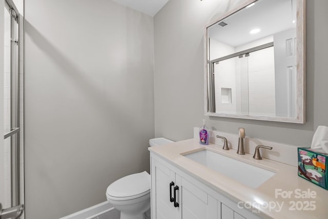 7502 Hurstbourne Green Dr, Charlotte, NC 28277 - full bathroom featuring toilet, vanity, a shower with door, and baseboards