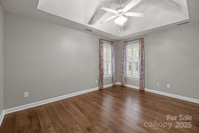 7502 Hurstbourne Green Dr, Charlotte, NC 28277 - empty room with visible vents, baseboards, a ceiling fan, and wood finished floors