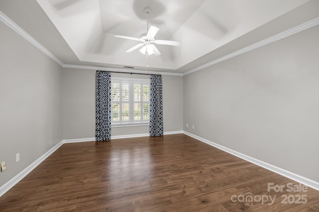 7502 Hurstbourne Green Dr, Charlotte, NC 28277 - spare room with dark wood-style flooring, baseboards, a raised ceiling, and a ceiling fan