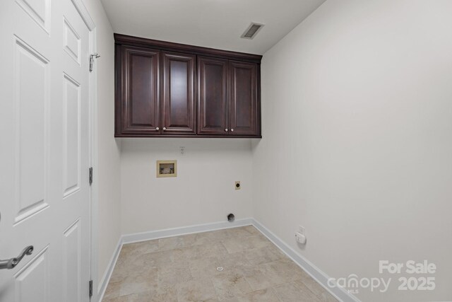 7502 Hurstbourne Green Dr, Charlotte, NC 28277 - clothes washing area featuring visible vents, baseboards, washer hookup, cabinet space, and electric dryer hookup