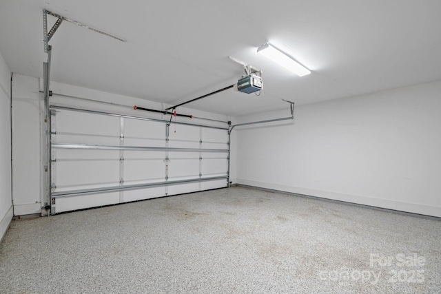 7502 Hurstbourne Green Dr, Charlotte, NC 28277 - garage featuring a garage door opener and baseboards